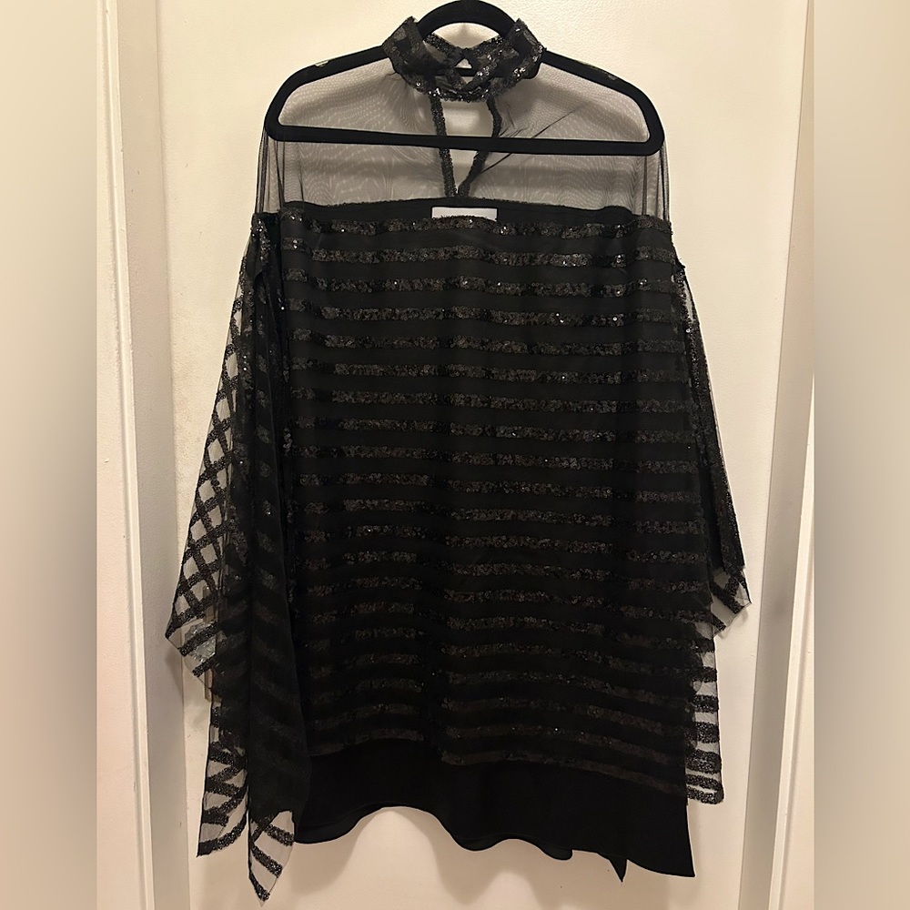 Black, sequinned Nino Lettieri cape style dress.
